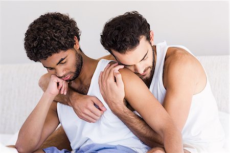 Gay couple together on bed Stock Photo - Premium Royalty-Free, Code: 6109-08390397