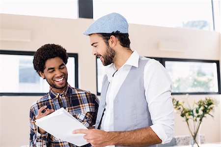 studio creative group - Happy gay couple holding document Stock Photo - Premium Royalty-Free, Code: 6109-08390334