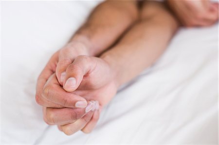 Close up of homosexual couple holding hands Stock Photo - Premium Royalty-Free, Code: 6109-08390405