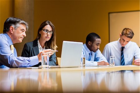 simsearch:6109-06684997,k - Business people working together during meeting Stock Photo - Premium Royalty-Free, Code: 6109-08394994