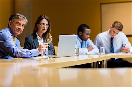 simsearch:6109-06684997,k - Business people working together during meeting Stock Photo - Premium Royalty-Free, Code: 6109-08394995