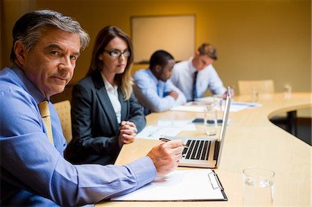 simsearch:6109-06684997,k - Business people working together during meeting Stock Photo - Premium Royalty-Free, Code: 6109-08394996