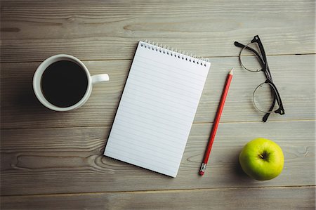 pencil (writing instrument) - Overhead view of office supplies and coffee Stock Photo - Premium Royalty-Free, Code: 6109-08395098