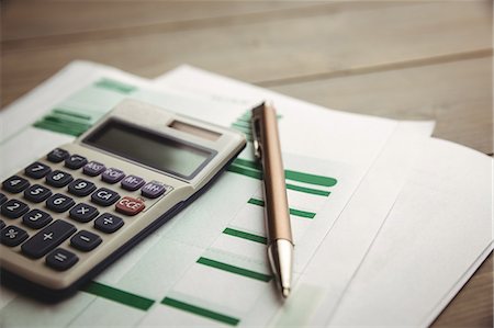 simsearch:6109-08395080,k - High angle view of calculator with sheets on desk Stock Photo - Premium Royalty-Free, Code: 6109-08395104