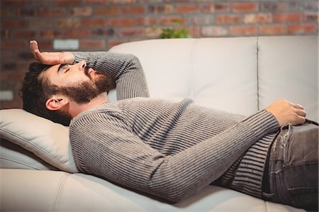 depressed young man - Man with hand on head at home Stock Photo - Premium Royalty-Free, Code: 6109-08395838