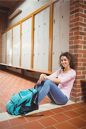 female student locker - Pretty student smiling at camera Stock Photo - Premium Royalty-Free, Code: 6109-08396355