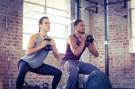 simsearch:689-03131217,k - Fit couple lifting kettle bells Stock Photo - Premium Royalty-Free, Code: 6109-08396994