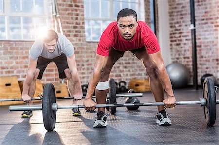 friends lifting someone - Fit people lifting a barbell Stock Photo - Premium Royalty-Free, Code: 6109-08397196