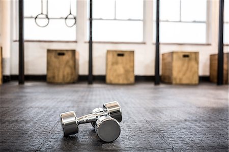 simsearch:6109-08397716,k - Silver dumbbells in the studio Stock Photo - Premium Royalty-Free, Code: 6109-08397713