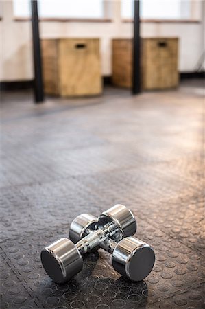 simsearch:6109-08397716,k - Silver dumbbells in the studio Stock Photo - Premium Royalty-Free, Code: 6109-08397714