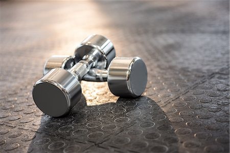 simsearch:6109-08397716,k - Silver dumbbells in the studio Stock Photo - Premium Royalty-Free, Code: 6109-08397715