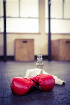 simsearch:6109-08397716,k - Boxing gloves on studio floor Stock Photo - Premium Royalty-Free, Code: 6109-08397718