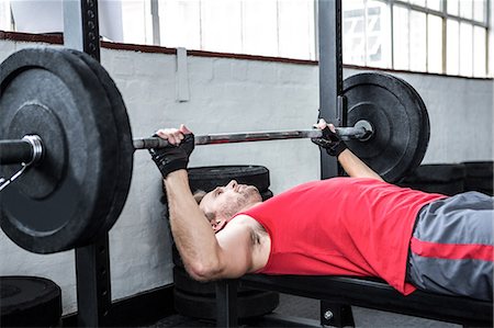 simsearch:6109-08397871,k - Fit man lifting heavy barbell Stock Photo - Premium Royalty-Free, Code: 6109-08397841