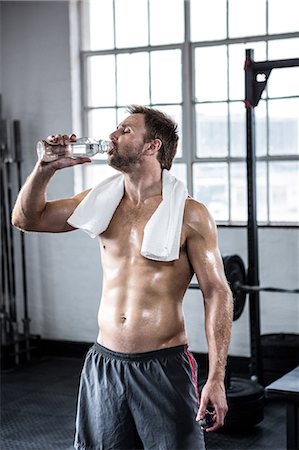 simsearch:6109-08397867,k - Fit man taking a drink of water Stock Photo - Premium Royalty-Free, Code: 6109-08397875