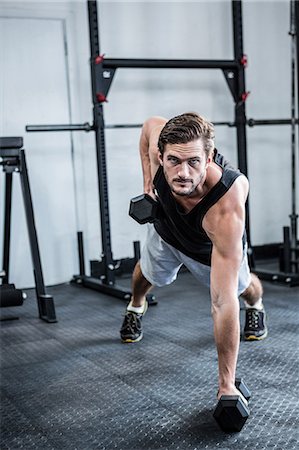 simsearch:6109-08397834,k - Fit man working out with dumbbells Foto de stock - Sin royalties Premium, Código: 6109-08397967