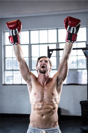 simsearch:6109-08397867,k - Fit shirtless man with boxing gloves Stock Photo - Premium Royalty-Free, Code: 6109-08398047