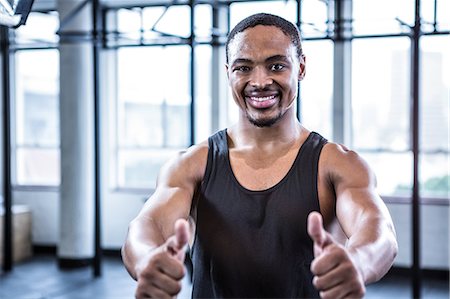 Fit man with thumbs up Stock Photo - Premium Royalty-Free, Code: 6109-08398103