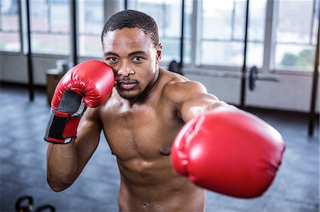 simsearch:6109-08397871,k - Fit shirtless man with boxing gloves Stock Photo - Premium Royalty-Free, Code: 6109-08398124