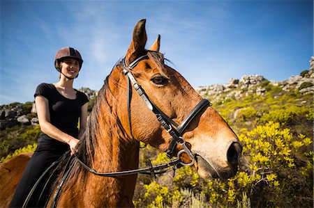 riding on a white horse - Young happy woman riding her horse Stock Photo - Premium Royalty-Free, Code: 6109-08398487