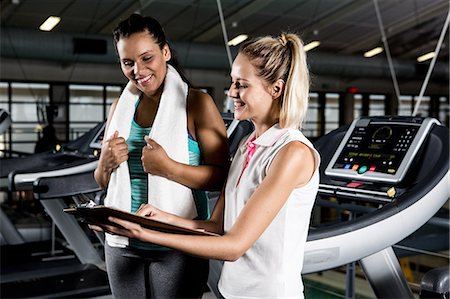 simsearch:6109-08398593,k - Pregnant woman with coach on treadmill Stock Photo - Premium Royalty-Free, Code: 6109-08398583