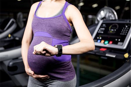 simsearch:6109-08398593,k - Pregnant woman with smart watch Stock Photo - Premium Royalty-Free, Code: 6109-08398538