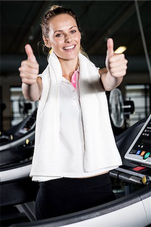 simsearch:6109-08398593,k - Blonde woman with thumbs up Stock Photo - Premium Royalty-Free, Code: 6109-08398601