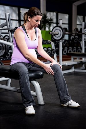 exercise machine - Pregnant woman with knee ache Stock Photo - Premium Royalty-Free, Code: 6109-08398615