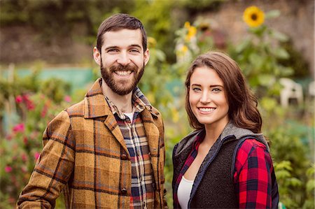 smiling couple in vegetable garden - Smiling couple in a garden Stock Photo - Premium Royalty-Free, Code: 6109-08398935