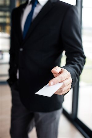 simsearch:6109-06684997,k - Businessman giving his business card Stock Photo - Premium Royalty-Free, Code: 6109-08399283