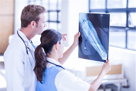 doctor intern male white - Medical team looking at x-ray together Stock Photo - Premium Royalty-Free, Code: 6109-08399349