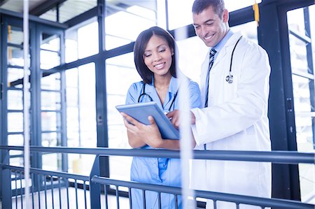 doctor intern male white - Nurse and doctor looking at a tablet Stock Photo - Premium Royalty-Free, Code: 6109-08399310
