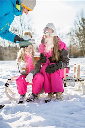 Family drinking tea on a beautiful snowy day Stock Photo - Premium Royalty-Free, Code: 6109-08481753