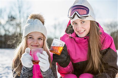 Mother and daughter drinking tea on a beautiful snowy day Stock Photo - Premium Royalty-Free, Code: 6109-08481755