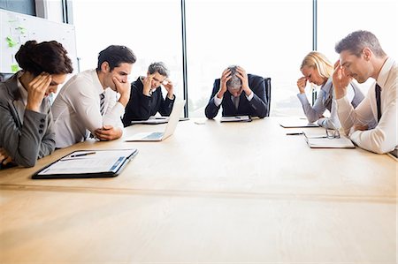 Business team hungover at meeting at the office Fotografie stock - Premium Royalty-Free, Codice: 6109-08488787