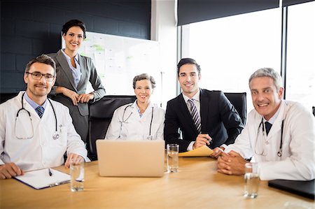 simsearch:6109-08804356,k - Medical team having a meeting at the office Stock Photo - Premium Royalty-Free, Code: 6109-08488867