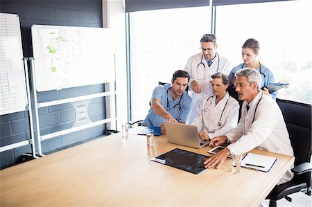 simsearch:6109-06005907,k - Medical team having a meeting at the hospital Stock Photo - Premium Royalty-Free, Code: 6109-08488897