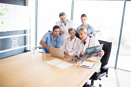 simsearch:6109-06005907,k - Medical team having a meeting at the hospital Stock Photo - Premium Royalty-Free, Code: 6109-08488898