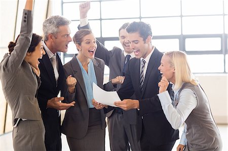 photo joyful - Business team cheering and shouting at the office Stock Photo - Premium Royalty-Free, Code: 6109-08488807