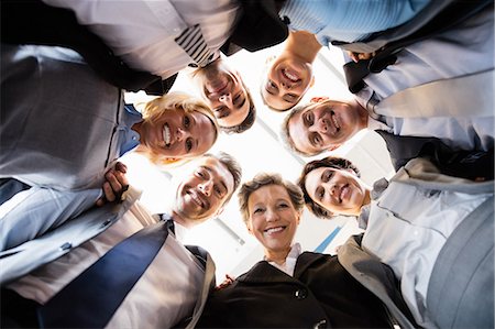 staff - Business team standing in circle at the office Photographie de stock - Premium Libres de Droits, Code: 6109-08488815