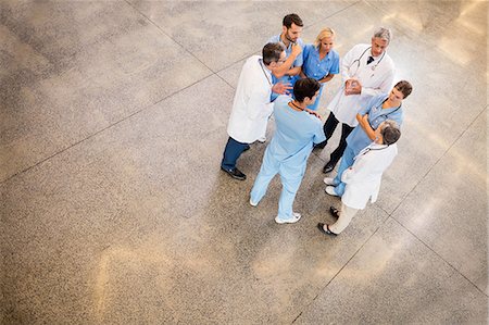 doctor intern male white - Medical team standing and talking at the hospital Stock Photo - Premium Royalty-Free, Code: 6109-08488947