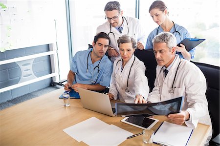 simsearch:6109-06005907,k - Medical team having a meeting at the hospital Stock Photo - Premium Royalty-Free, Code: 6109-08488900