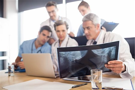 simsearch:6109-06005907,k - Medical team having a meeting at the hospital Stock Photo - Premium Royalty-Free, Code: 6109-08488901