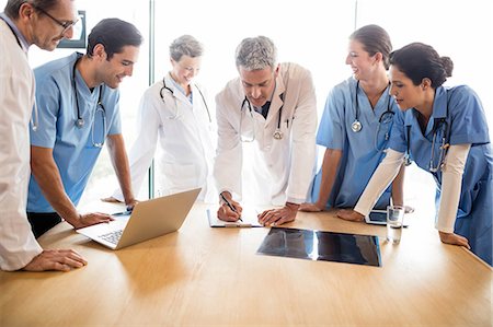 simsearch:6109-06005907,k - Medical team having a meeting at the hospital Stock Photo - Premium Royalty-Free, Code: 6109-08488907