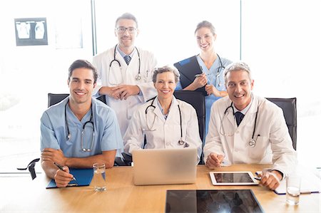 simsearch:6109-06005907,k - Medical team having a meeting at the hospital Stock Photo - Premium Royalty-Free, Code: 6109-08488905