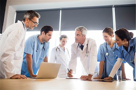 simsearch:6109-06005907,k - Medical team having a meeting at the hospital Stock Photo - Premium Royalty-Free, Code: 6109-08488908