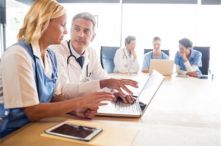 simsearch:6109-06005907,k - Medical team having a meeting at the hospital Stock Photo - Premium Royalty-Free, Code: 6109-08488911