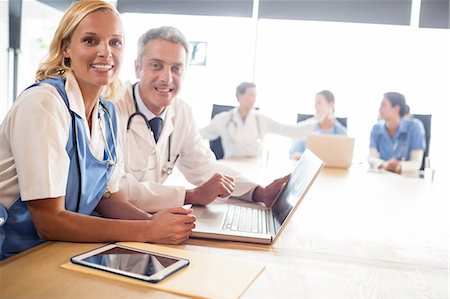 simsearch:6109-06005907,k - Medical team having a meeting at the hospital Stock Photo - Premium Royalty-Free, Code: 6109-08488912