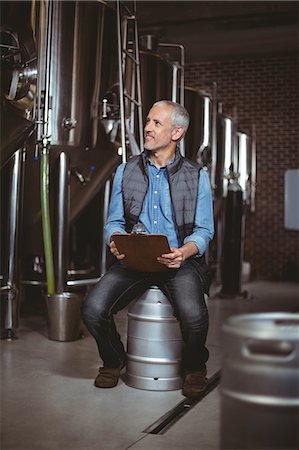 food processing plant - Local brewer reading in the plant at the local brewery Stock Photo - Premium Royalty-Free, Code: 6109-08489289