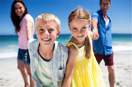 Cute family holding hands on the beach Stock Photo - Premium Royalty-Free, Code: 6109-08434770