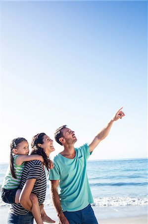 simsearch:6109-06003758,k - Cute family looking at something on the beach Stock Photo - Premium Royalty-Free, Code: 6109-08434862